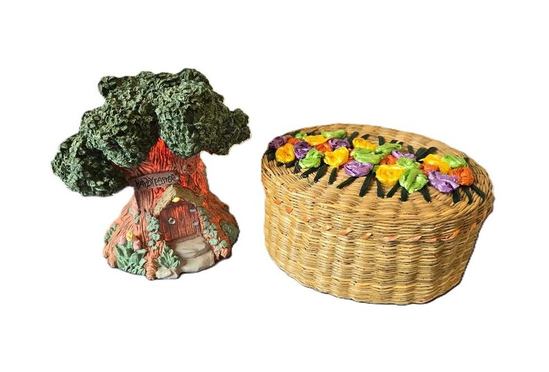 May include: A miniature treehouse with a sign that reads "Welcome" and a wicker basket with colorful flowers around the top.