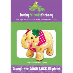 May include: A soft toy elephant named Georgie, with a yellow floral pattern, pink polka dot accents, and a green four-leaf clover. The packaging features the text "funky friends factory" and "Soft toys you'll LOVE to make and make to LOVE!" The elephant is 8.5 inches tall.