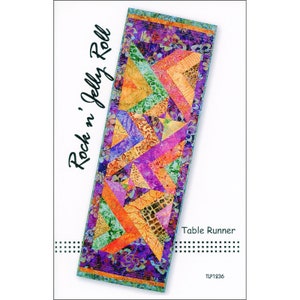 May include: A colorful table runner with a patchwork design. The runner features a variety of fabrics in shades of purple, orange, green, and yellow. The text "Rock n' Jelly Roll" and "Table Runner" are visible. The product code is TLP1236.