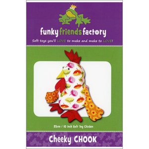 May include: A soft toy chicken pattern kit. The chicken is white with a floral pattern, red comb, yellow beak, and orange and yellow accents. The kit is labeled "Cheeky CHOOK" and measures 10 inches (25 cm). The packaging features a green frog.