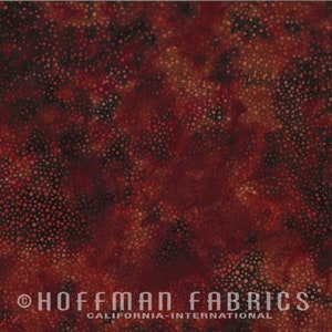 May include: A close-up of a fabric with a mottled pattern in shades of red, brown, and black. The fabric has a speckled design, with small, light-colored dots scattered across the surface. The text "HOFFMAN FABRICS CALIFORNIA-INTERNATIONAL" is at the bottom.