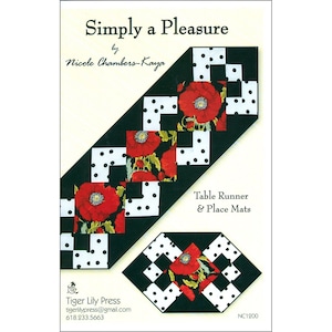 May include: A pattern for a table runner and place mats. The design features a black and white polka dot pattern with red poppy flower accents. The text "Simply a Pleasure" and "Table Runner & Place Mats" are visible.