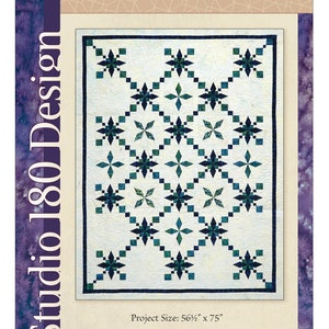 May include: A quilt pattern titled "Emerald Isle" by Studio 180 Design. The quilt design features a repeating pattern of dark teal and green starbursts on a cream background, with a dark teal border. The project size is 56.5" x 75".
