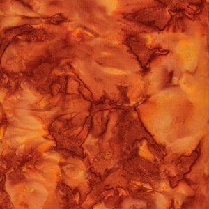 May include: Abstract fabric with a watercolor effect. The fabric features a blend of warm colors, including shades of orange, brown, and yellow. The design has a marbled appearance with organic shapes and patterns, creating a textured look.