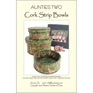 May include: Image of three green and brown cork strip bowls of varying sizes, one open and two covered. The bowls are made from cork fabric and are labeled "Aunties Two Cork Strip Bowls". The image also includes a framed photo and a small pig figurine.
