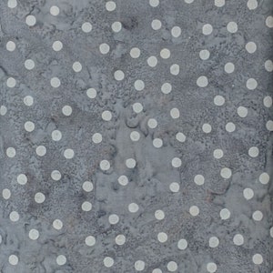 May include: A close-up of a fabric with a gray background and a pattern of white polka dots. The fabric has a textured appearance, with the dots evenly spaced across the surface. The overall effect is a simple, yet visually appealing design.