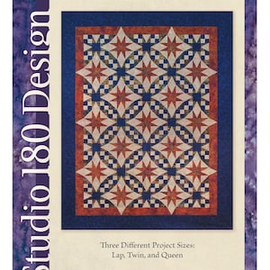 May include: A pattern for a quilt titled "Galaxy" by Deb Tucker. The design features a central square with a star pattern in red, white, and blue, surrounded by a blue border. The pattern offers three project sizes: Lap, Twin, and Queen.