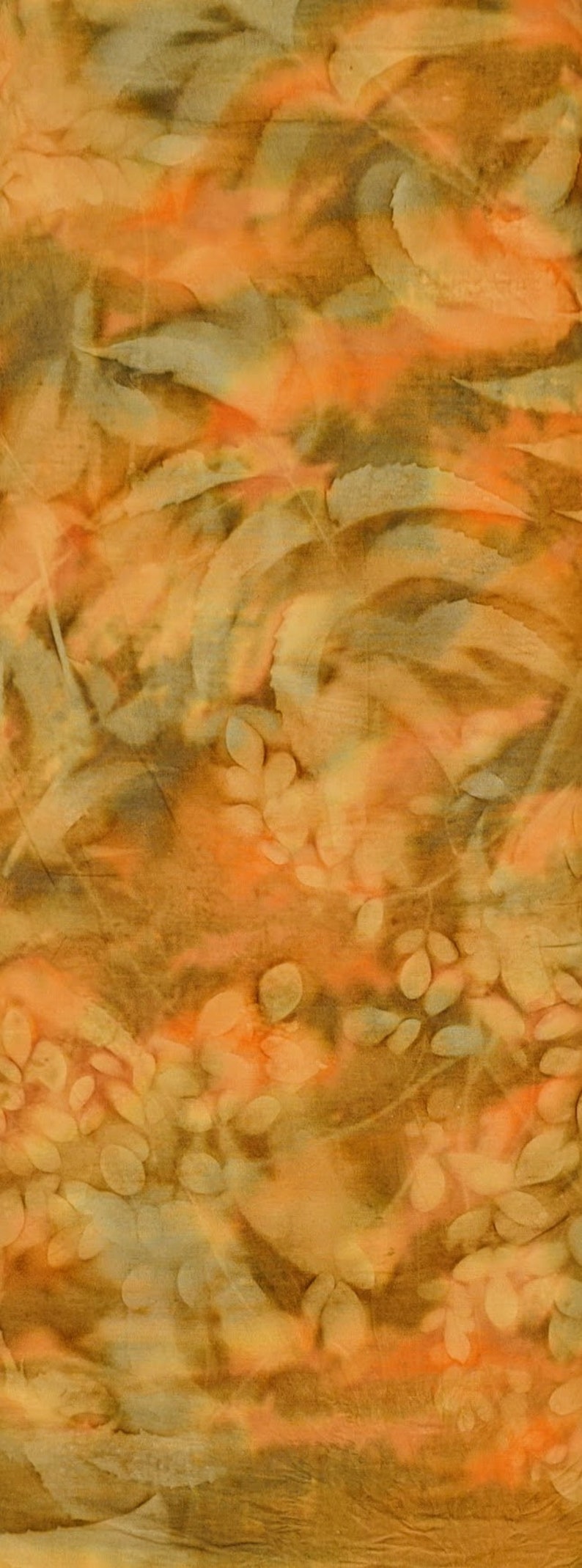 May include: Abstract textile in warm tones. The design incorporates orange, brown, and cream colours, with leaf-like and organic shapes. The fabric has a textured appearance, creating a visual depth.