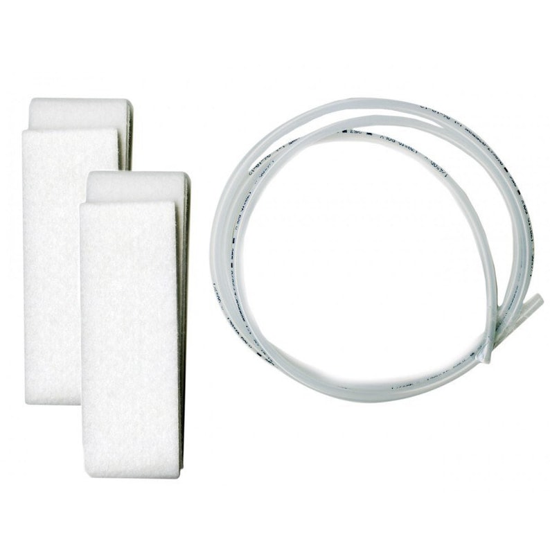 May include: An overhead shot shows three white rectangular filters and a coiled clear tube. The filters are made of a porous material. The tube is clear with some text printed along its length. The items are set against a white background.