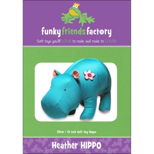 May include: A teal soft toy hippo with pink accents, including flower and ear details. The image features the text "funky friends factory" and "Soft toys you'll LOVE to make and make to LOVE!" The hippo measures 13 inches.