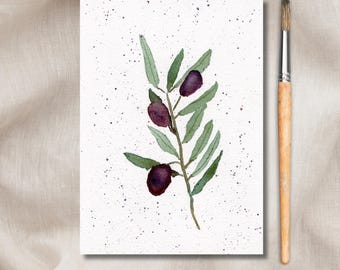 May include: A watercolour painting of an olive branch with three olives. The olives are a deep purple colour and the leaves are a light green. The background is white with a speckled texture.