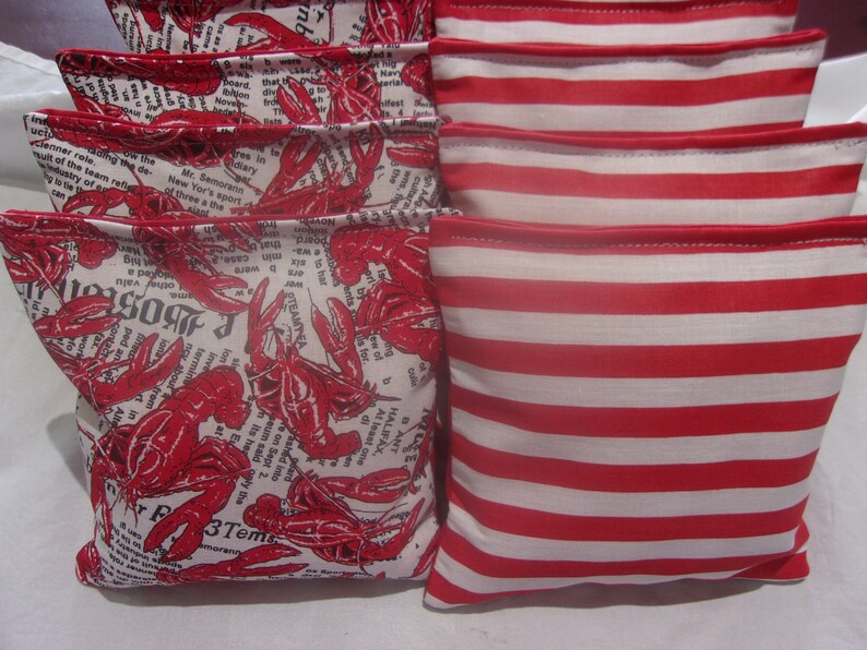 4 Lobsters on Newspapers and 4 Red and White Stripe 8 ACA Regulation Cornhole Bags