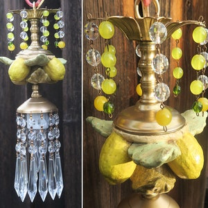 May include: A gold chandelier with a cluster of yellow and green glass beads and crystal drops. The chandelier is decorated with three yellow lemons.