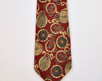 May include: A red silk tie with a gold and black pattern of intricate clock faces and swirls.