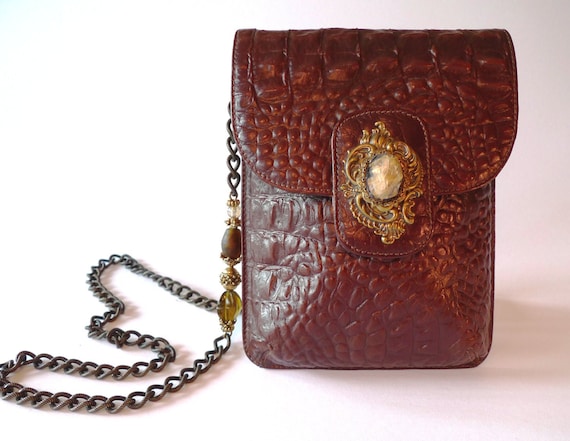 Mahogany colored reptile leather bag with shoulder chain