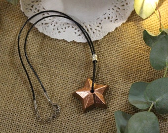 Copper star necklace in tinted concrete