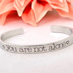 You are not alone stamped  bracelet- hard times, inspiration great gift- friends - family - inspiration with hearts on the side - adjustable