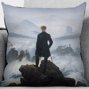May include: A painting depicting a man standing on a rocky cliff overlooking a sea of clouds. The man is wearing a dark coat and has his back to the viewer. The sky is a light blue and the clouds are white. The painting is a classic example of Romanticism.