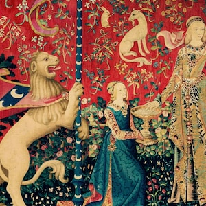 May include: A tapestry depicting a scene from the Lady and the Unicorn series. A white lion stands on its hind legs, holding a staff with a crescent moon design. A woman in a blue dress holds a chalice, while another woman in a gold dress stands behind her. The tapestry is filled with intricate details, including flowers, leaves, and other animals.