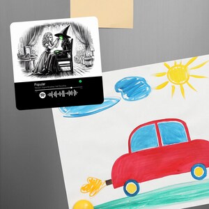 May include: A black and white illustration of a woman putting green makeup on another woman. The image is on a white square with a black background. The background also includes a Spotify code and the text "Popular" and "Wicked Original Broadway Cast Recording".