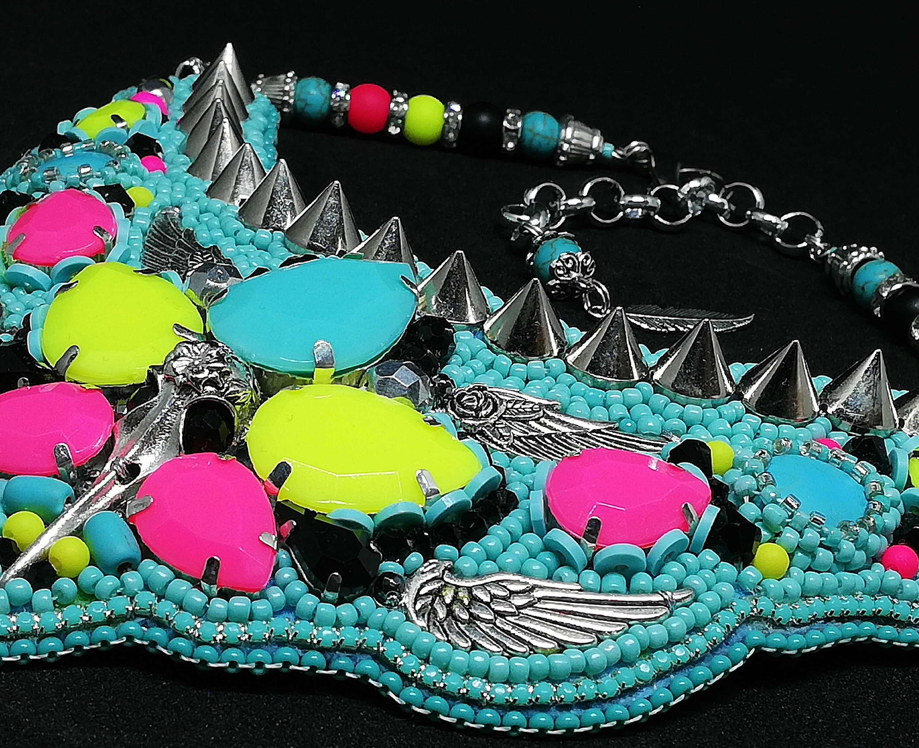 Chunky neon statement necklace with a punk tribal festival vibe