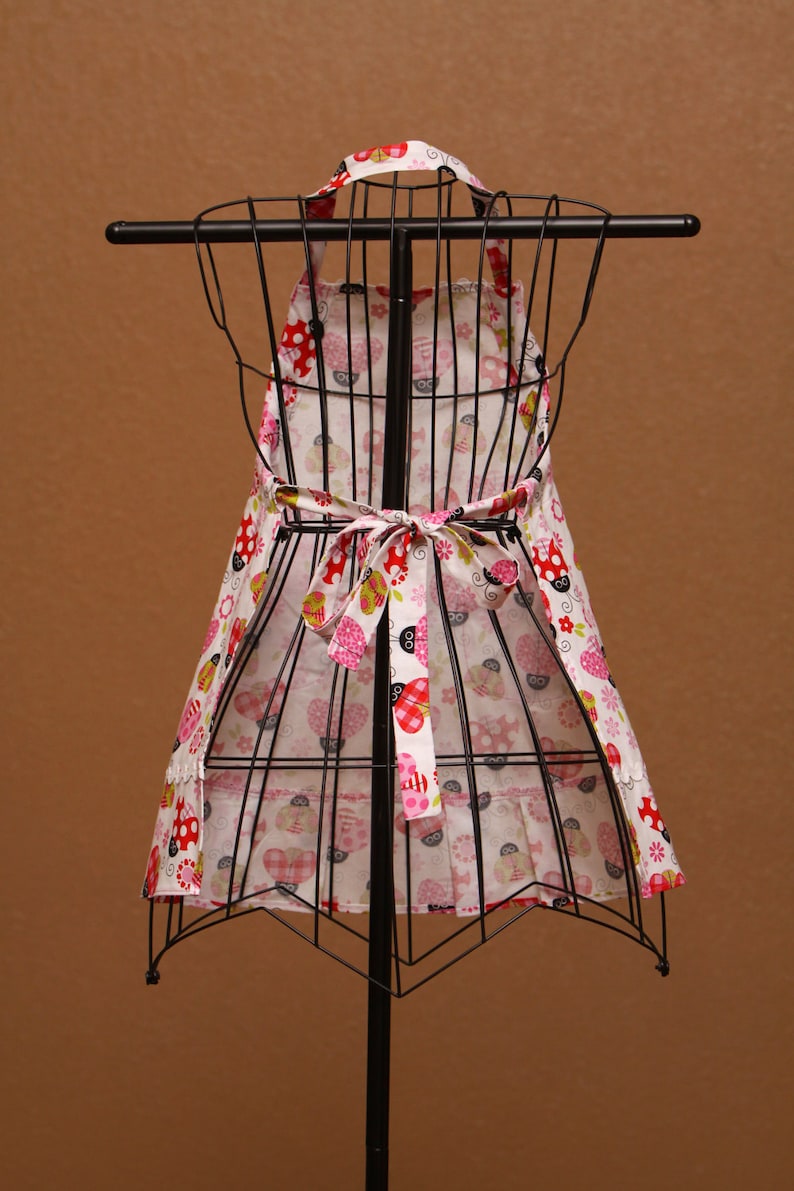 Colorful Ladybugs with Pink Trim on White Background Childrens Apron
