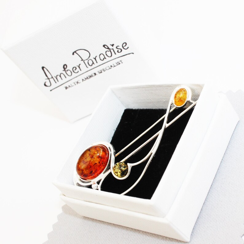 Graceful Amber Brooch containing three amber pieces set in a swirl of sterling amber accessory amber pin silver 925 amber jewellery