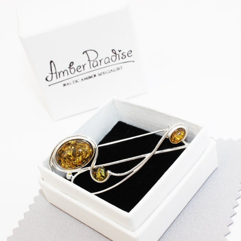 Graceful Amber Brooch containing three amber pieces set in a swirl of sterling amber accessory amber pin silver 925 amber jewellery