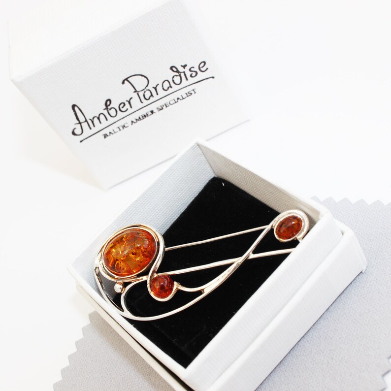 Graceful Amber Brooch containing three amber pieces set in a swirl of sterling amber accessory amber pin silver 925 amber jewellery
