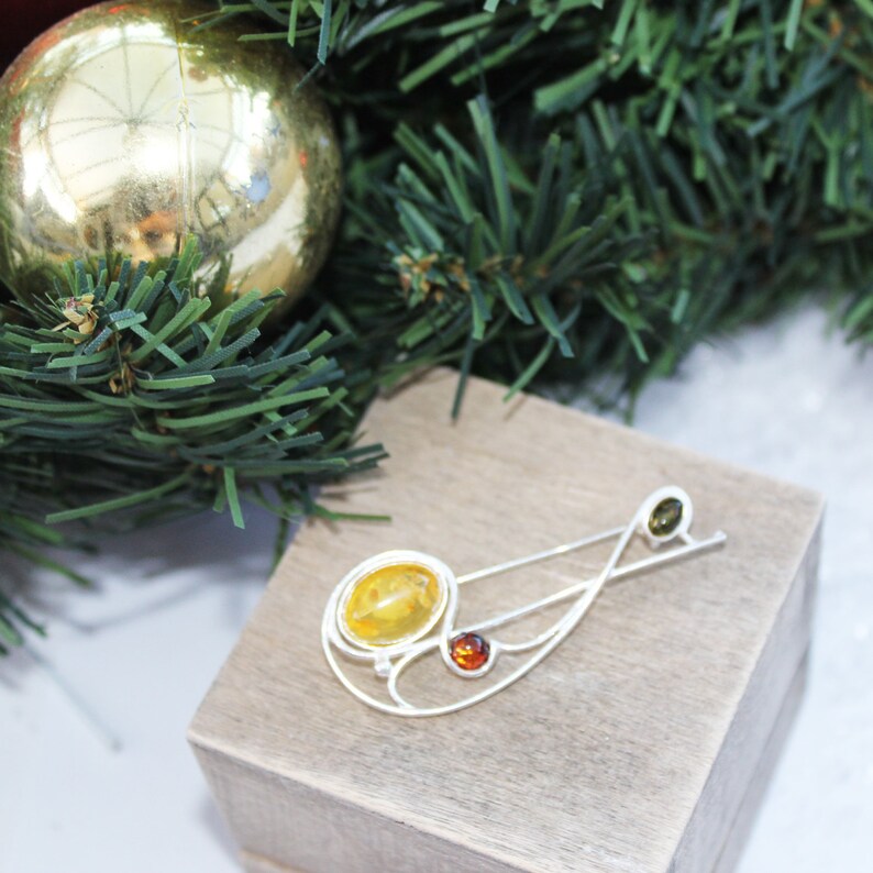 Graceful Amber Brooch containing three amber pieces set in a swirl of sterling amber accessory amber pin silver 925 amber jewellery