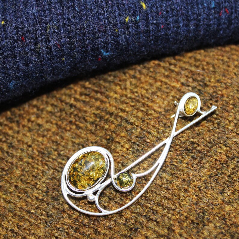 Graceful Amber Brooch containing three amber pieces set in a swirl of sterling amber accessory amber pin silver 925 amber jewellery