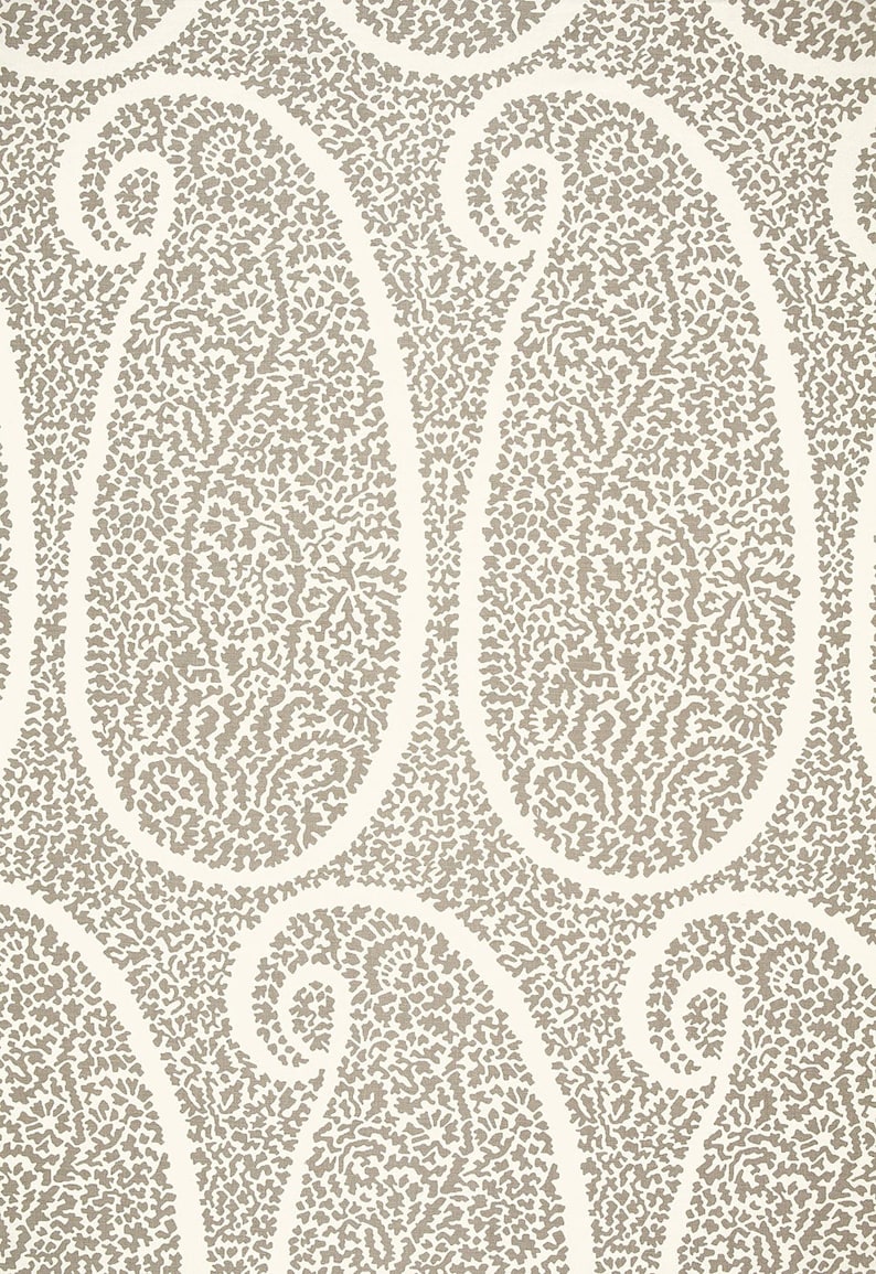 May include: A seamless pattern of paisley shapes in a light brown color on a white background.