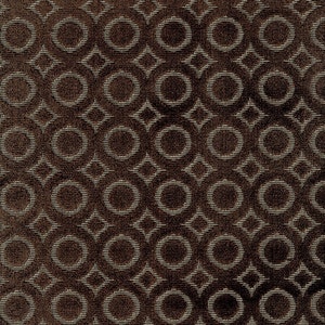 May include: A brown fabric with a repeating pattern of white circles and a geometric design.