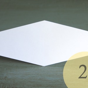 May include: A white, hexagonal-shaped card with a 2-inch measurement label.