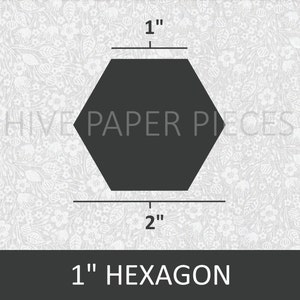 May include: A black 1-inch hexagon shape on a white background with a floral pattern. The hexagon is 1 inch wide and 2 inches long. The text "Hive Paper Pieces" is visible in the background.