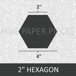May include: A 2-inch hexagon shape, outlined in black, on a white background with a floral pattern. The text "HIVE PAPER PIECES" is visible in the center of the hexagon. The hexagon is labeled "2" inch hexagon".