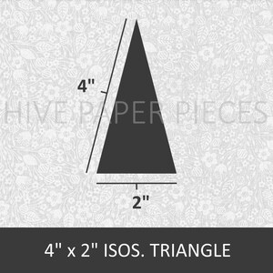 May include: A black isosceles triangle with a base of 2 inches and a height of 4 inches. The triangle is on a white background with a floral pattern.
