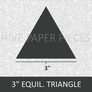 May include: A black 3-inch equilateral triangle on a white background with a floral pattern. The triangle is a paper piece for crafting.