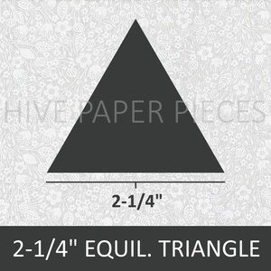 May include: A black equilateral triangle with a side length of 2-1/4 inches. The triangle is on a white background with a floral pattern. The text "2-1/4" EQUIL. TRIANGLE" is below the triangle.