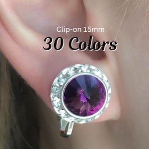 May include: A round clip-on earring featuring a large, faceted deep purple center stone surrounded by a border of smaller clear crystals. The text Clip-on 15mm 30 Colors is visible above the earring, which measures 15mm in diameter.
