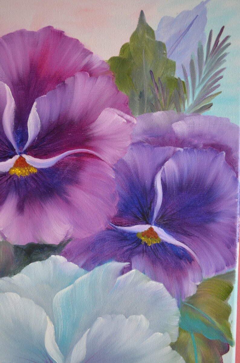 May include: A close-up of a painting of purple and blue pansies with white accents. The pansies are in focus, while the background is blurred.