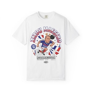 White Comfort Colors tee featuring Zinedine Zidane France 98 No. 10 comic art with Artiste de Marseille banner on a plain background