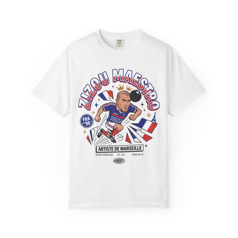 White Comfort Colors tee featuring Zinedine Zidane France 98 No. 10 comic art with Artiste de Marseille banner on a plain background