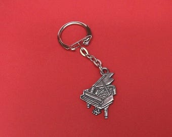 Vleugelontwerp tinnen sleutelhanger - pianosleutelhanger - pianobedel - cadeau voor pianist - cadeau pianoleraar - sleutelhanger muziek - cadeau muzikant