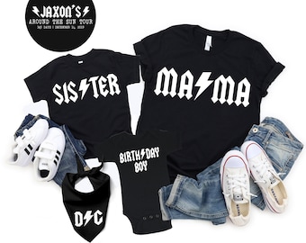 May include: Black t-shirts with white lightning bolt designs that say "Sister", "Mama", and "Birthday Boy". A black bandana with white lightning bolt design that says "D/C".