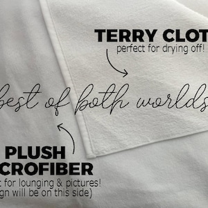 May include: A white towel with two different sides. One side is made of terry cloth, perfect for drying off. The other side is made of plush microfiber, perfect for lounging and pictures. The text "best of both worlds" is written in cursive on the towel.
