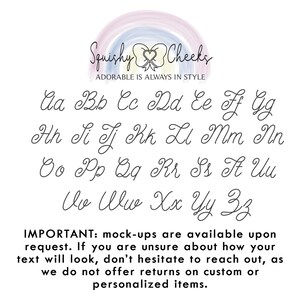 May include: A white background with a rainbow arc at the top. The text "Squishy Cheeks" is in black cursive font with a heart and bow tie design. Below the text is "ADORABLE IS ALWAYS IN STYLE". The rest of the image shows the alphabet in cursive font, with each letter on a separate line. The text "IMPORTANT: mock-ups are available upon request. If you are unsure about how your text will look, don't hesitate to reach out, as we do not offer returns on custom or personalized items." is at the bottom of the image.