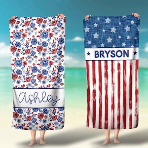 May include: Two personalized beach towels with red, white, and blue designs. One towel features a floral pattern with the name "Ashley" and the other features a red, white, and blue striped pattern with the name "Bryson".