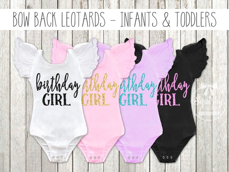 May include: Four white, pink, lavender, and black leotards with ruffled sleeves. Each leotard has the text "birthday girl" in gold glitter lettering.