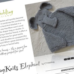 May include: A gray knitted elephant hooded blanket for babies. The blanket is made with a soft yarn and has a cute elephant face on the hood. The text "Hug Knits Elephant" is written in a decorative font.
